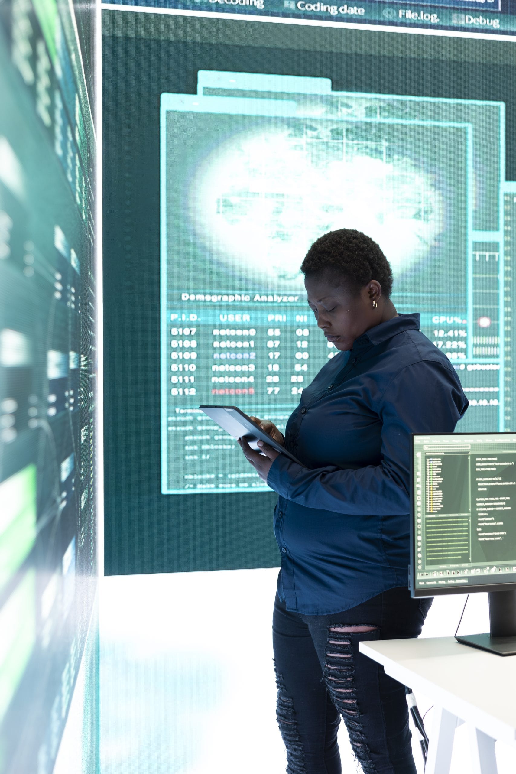 governmental-hacker-woman-working-with-tablet-big-screen